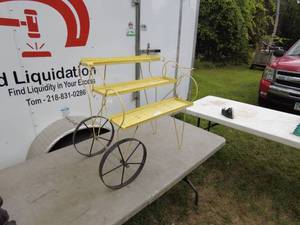 lot 320 image: Vintage Yellow Metal Plant Stand with Wheels