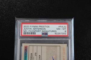 lot 1 image: 2020 Prestige NFL Passport Signatures Justin Jefferson Autograph #PAJU PSA 8 Rookie Card