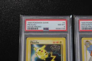 lot 24 image: 1999 Pokemon Movie Promo #3 MewTwo - #4 Pikachu - #5 Dragonite  PSA 8 Lot