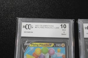 lot 54 image: Pokemon Surfing Pikachu V #008025 & Flying Pikachu V #006025 BCCG 10 Lot  2 Cards