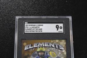 lot 67 image: 2023 Bowman U Chrome Elements of the Game Gold Refractor JJ McCarthy 2850 Rookie Card SGC 9  Only 50 Exist