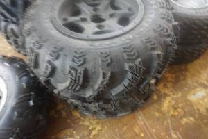 lot 197 image: 2 - Sling Shot AT ATV Tires on Black 4 Bolt Rims