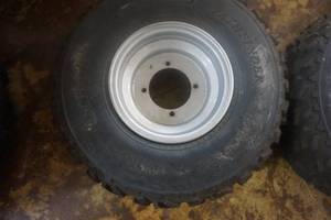 lot 203 image: 2 - Pathfinder ATV Tires On 4 Bolt Rims