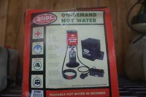 lot 260 image: Zodi Outback Gear Portable Hot Water System