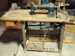 lot 13 image: Vintage Heavy Duty Sewing Machine on Table, Motorized with Accessories