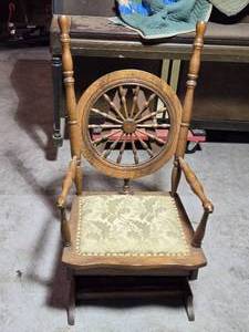 lot 26 image: Antique Oak Rocking Chair with Spindle Ships Wheel Back and Upholstered Seat