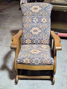 lot 27 image: Antique Oak Platform Rocking Chair with Upholstered Seat and Decorative Pattern