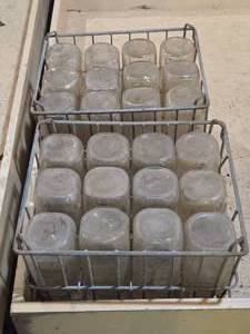 lot 34 image: 2 Vintage Milk Crates and Milk Bottles