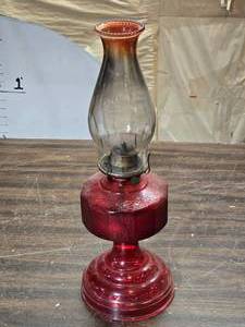 lot 125 image: Vintage Red Glass Oil Lamp with Eagle Burner