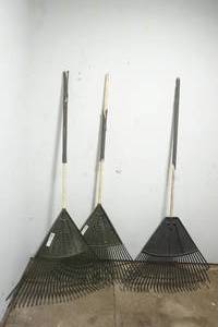 lot 161 image: Plastic lawn rakes with wood handles