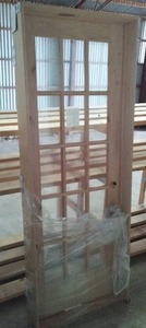lot 715 image: Bayer 30 in. Int.  Pre-Hung 15 Panel Glass Door. Knotty Alder