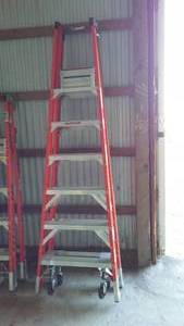 lot 843 image: Werner 6 ft. Fiberglass Rolling Ladder.