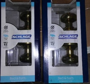 lot 869 image: Schlage Bed and Bath Door set (2) Bright Brass.