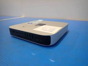 lot 56 image: Apple&nbspMacmini7,1 Mini PC &nbspINTEL CORE I5-4278U 2.6 Ghz  16GB LPDDR3 SDRAM  NO HD  Includes power cable  Minor blemishes and scratches on case