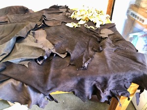 lot 164 image: Large Lot of TannedDyed Genuine Leather Hides
