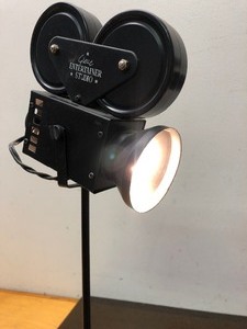 lot 104 image: Pair of Great Entertainer Studio Old-Time Movie Camera & Stage Light Lamps