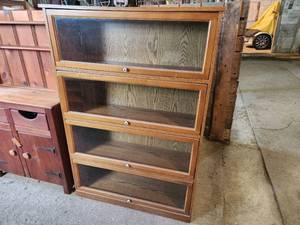 lot 41 image: Wooden Bookshelf with Fold-Down Glass Doors