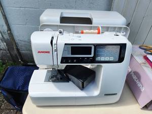 lot 61 image: Janome Sewing Machine with Rolling Case