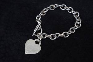 lot 172 image: Sterling Silver Heart on Charm Bracelet