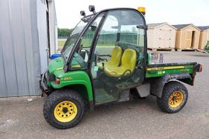 lot 1 image: 2009 John Deere Gator 850D Diesel XUV - Enclosed Cab, Salt Spreader - NOT Running