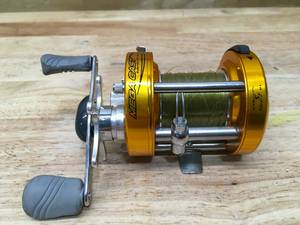 lot 35 image: Bass Pro Shops MegaCast Metal Round Baitcast Reel Model # MCM 2000