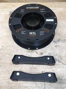 lot 132 image: Spool of 3D printer filament and 2 filament holders