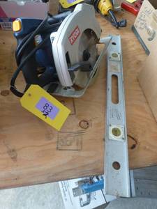 lot 83 image: Ryobi 7-14 inch circular saw and level
