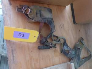 lot 91 image: Two VintageAntique corn shucker wrist harnesses