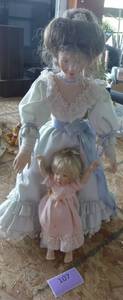 lot 107 image: Vintage Loving Steps by Sandra Kuck porcelain doll with child