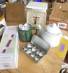 lot 123 image: Kitchen scale, tea pot, cup, Pampered chef cutters, and Gripper for cutting fabric