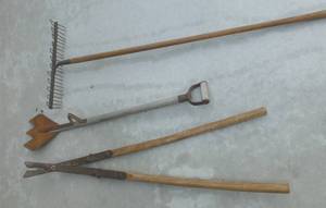 lot 173 image: THREE Antique tools - tree trimmer, hay cutter, rake