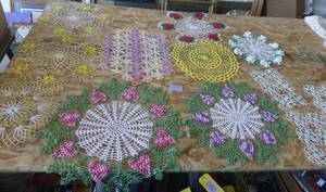 lot 203 image: Colorful intricate and starched doilies