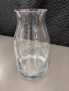 lot 9 image: MI 1 - Clear Glass Vase with The Mission VHS Tape