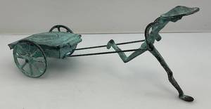 lot 39 image: MCM Rickshaw Figurine Cigarette Holder