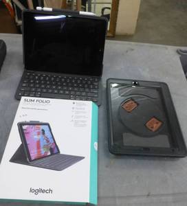 lot 98 image: iPad A1701 with the attachable keyboard and a Newtrent easy to hang onto case