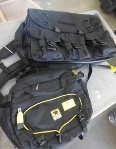 lot 129 image: One small backpack type bag and One tactical style laptop bag
