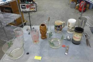 lot 157 image: Vintage bar supplies, including Hamms and Schlitz tumblers, White Horse sign and cocktail mixers