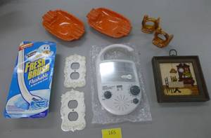 lot 165 image: New shower radio, vintage orange melmac ashtrays, new outlet covers