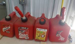 lot 189 image: FOUR one and two gallon gas jugs