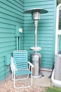 lot 3 image: Outdoor Propane Patio Heater wStrapped Lawn Chair...
