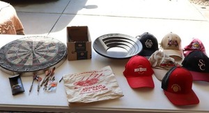 lot 69 image: Eastpoint Sports Kingston Bristle Dartboard-Zuhrah Pipe Band-Collection Of Miscellaneous Hats