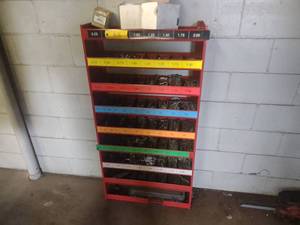 lot 33 image: Wall Mounted Rack with New Wheel Ba...