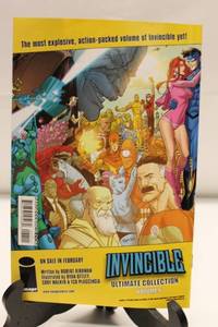 lot 93 image: Invincible Ultimate Collection Volume 6 and Issue #77 Comic Books