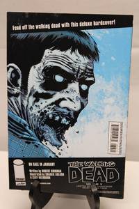 lot 448 image: Lot of Comic Books The Walking Dead Volume 3 & Invincible #76
