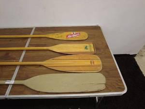 lot 189 image: Collection of Four Wooden Canoe Paddles - Sawyer Woodworking, Bending Branches, and Leinenkugels Beer