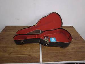 lot 208 image: Vintage Guitar Case with Extra Strings