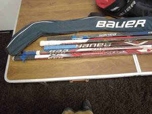 lot 94 image: Lot of Bauer and CCM Hockey Sticks with Bauer Vapor Tapered Fit Pants
