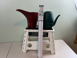 lot 166 image: Foldable Step Stool, Watering Cans, and Window Film.