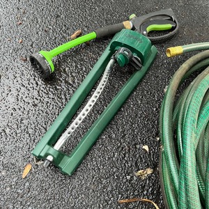 lot 59 image: Garden Hose and Sprinkler Lot