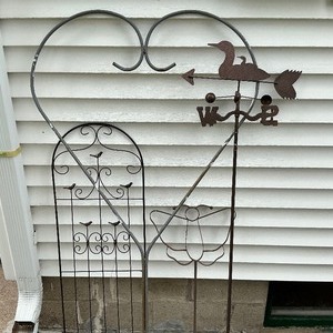 lot 70 image: Four Metal Yard Dcor Stands